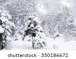 Trees covered with hoarfrost and snow and blue sky in mountains - Christmas background
