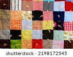 Small photo of Patchwork quilt handmade blanket with quilting design for home comfort