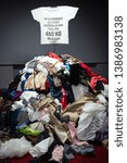 Small photo of BRATISLAVA, SLOVAKIA - MAY 1, 2019: Installation of Pile of old worn clothes during Fashion revolution week. Approximately 460 kgs of clothes is thrown away every 10 minutes in Slovakia.