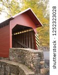 Small photo of The Red Roddy River Covered Bridge allows passage over the river by the same name in Maryland