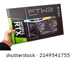 Small photo of Budapest, Hungary - Circa 2020: Nvidia Geforce RTX 3090 Graphics Card made by EVGA in its box. High end GPU of the Nvidia RTX 30 series, white background, held in hand