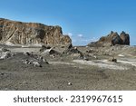 Desolate volcanic landscape on White Island, New Zealand, active volcano island. Helicopter in the distance for touristic visits