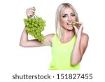 blond woman holding ripe grapes, on white