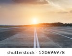 Runway, airstrip in the airport terminal with marking on blue sky with clouds background. Travel aviation concept.