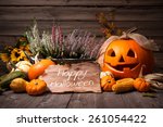 Halloween still life with pumpkins and holiday text