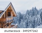 winter holidays, ski vacations background, wooden house under snow in the Alps