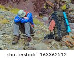 Trekker resting in height mountain  India
