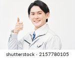 Asian Worker Thumbs Up Gesture...