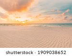 Closeup sea sand beach. Panoramic beach landscape. Inspire tropical beach seascape horizon. Orange and golden sunset sky calmness tranquil relaxing sunlight summer mood. Vacation travel holiday banner