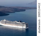 Small photo of SANTORINI, GREECE-AUGUST, 20, 2014: MSC Fantasia cruise ship near Santorini island in Aegean sea. MSC Fantasia is the largest cruise ship ever built for a European ship owner. It has 1637 staterooms.