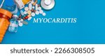 Small photo of Myocarditis text disease on a medical background with medicines