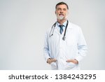 Cheerful mature doctor posing...