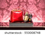 The showcase in a luxury fashion store with branded shoes and handbag