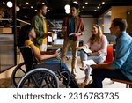 Small photo of Diverse male and female colleagues in discussion in casual office meeting. Casual office, teamwork, disability, inclusivity, business and work, unaltered.