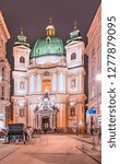 Small photo of St. Peter's Catholic Church with Traditional old-fashioned phaeton at night - Vienna, Austria