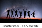 silhouette of friends jumping... | Shutterstock . vector #1577459482