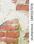 Small photo of A old cement wall in which you can see the bricks underneath, a concept of the inexorable passage of time. background with space for text and copy