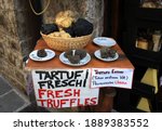 Small photo of Various truffles on display in Umbria, Italy. Translation of various Italian texts: on the plates, tutti means all. The non-translated paper says Summer Truffles, provenance: Umbria.