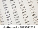 Small photo of document with many numbers, data encrypt. Cipher encryption code or data, closeup