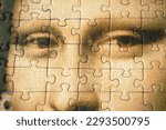 Jigsaw Puzzle Of Female Face Mona Liza La Gioconda from Leonardo Da Vinci, from ancient painting on wooden background, closeup