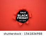 Black Friday sale concept. Top view of red torn paper and text black Friday on black background. Copy space, close up, top view, flat lay