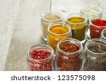Spices In Glass Jars On Rustic...