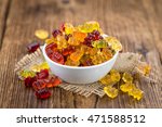 Bowl with Gummy Candy (selective focus) on wooden background