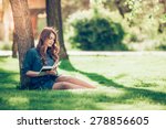 Girl Reading A Book In Park ...