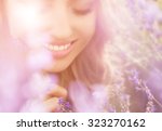 Beautiful young woman portrait in lavender field