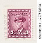 Small photo of SEATTLE WASHINGTON - May 8, 2020: King George VI War Issue Canadian Stamp of 1942, with margin and copy space. Scott # 252