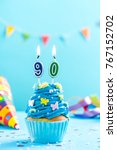 Small photo of Ninetieth 90th birthday cupcake with candle and sprinkles. Card mockup.