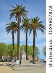 Small photo of The bust of Pascal Paoli is surrounded with the palm trees in the main square with a covered market.