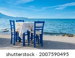 Blue Chairs And Table In...