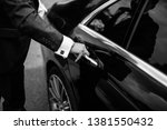 Hand on handle. Close-up of Asian man hand opening / close a car door, chauffeur car service background concept
