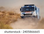 Small photo of Extreme off-road racing. NEW Sports truck KAMAZ gets over the difficult part of the route during the Rally raid in sand. 14.07.2022 Kalmykia, Russia.
