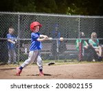 A Youth Baseball Player Takes A ...