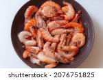 Small photo of Frozen shrimp defrosted in a plate
