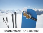 Small photo of Blank ski pass and winter sport equipment such as ski and snowboard waiting on top of mountain ready for you. Concept to illustrate ski admission fee