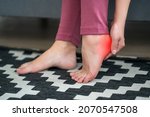 Plantar fasciitis, heel spur, foot pain, man suffering from feet ache at home, podiatry concept
