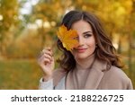 Outdoor atmospheric lifestyle portrait of young beautiful lady. Warm autumn