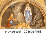 Small photo of COURMAYEUR, ITALY - JULY 12, 2022: The fresco of apparition of Virgin Mary in Lourdes in church Chiesa di San Pantaleone by Nino Pirlato (1957).