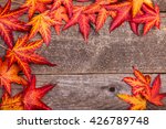 Styled stock autumnal photograph, autumn leaves on a wooden background, copy space for your business message, promotion, headline