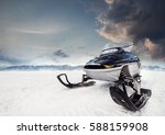 Small photo of Snowmachine on the mountain lake frozen surface with thunderstorm clouds on the background