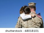 Military man hugs daughter