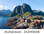 Scenic town of Reine by the fjord on Lofoten islands in Norway on sunny summer day