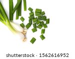 Fresh ripe green spring onions (shallots or scallions) with fresh chopped green onions on white background