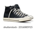 Small photo of High black sneakers isolated on white background