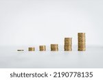 growing stacks of coins representing increasingly expensive prices or savings and compound interests increasing, finance and money conceptual image