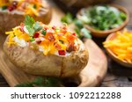 Baked Potatoes With Cheese And...