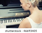 Portrait of woman playing on the retro style piano. Sligtly toned image to make look old. Vintage museum piano with date inscription about 1882 edition. Not copyrighted now.